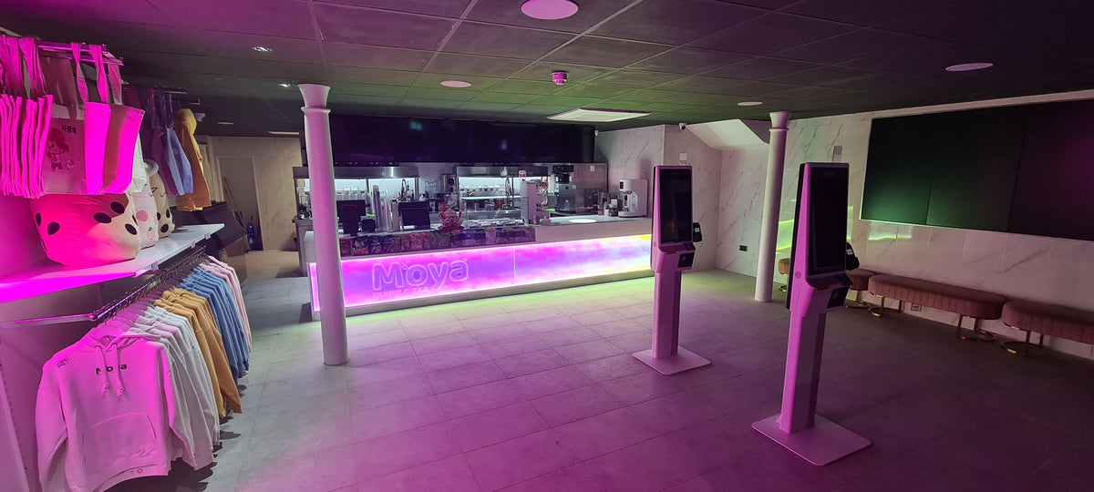 Illuminated servery counter within a completed retail interior