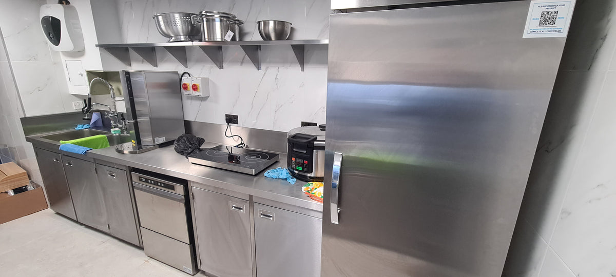 Installed stainless steel counter and under-counter equipment in a commercial kitchen